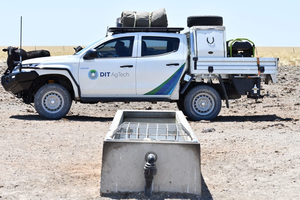 DIT AgTech truck in front of a trough