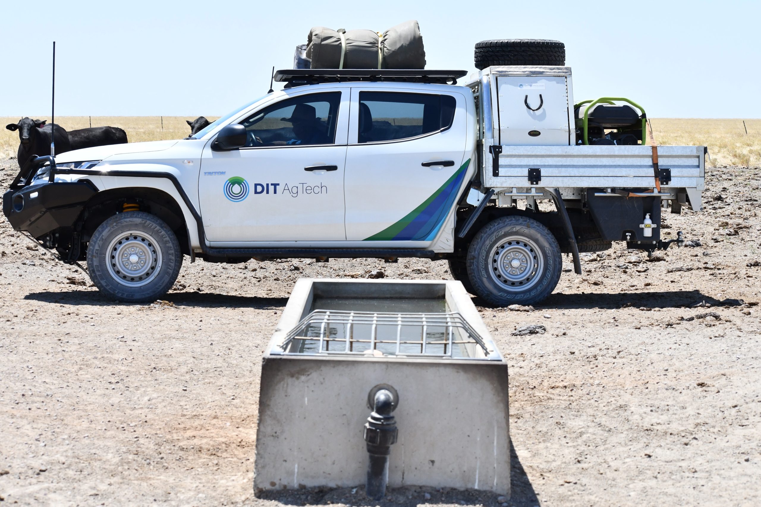 DIT AgTech truck in front of a trough